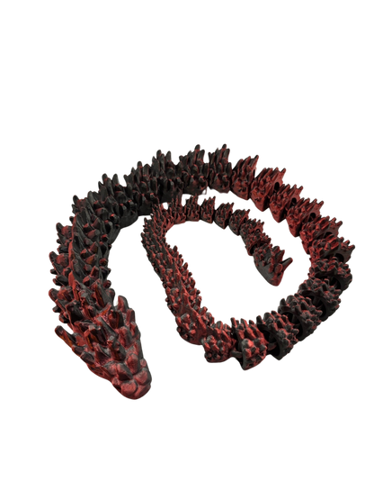 Bewegliche Lava-Drachen-Schlangen auf schwarzer Fläche

