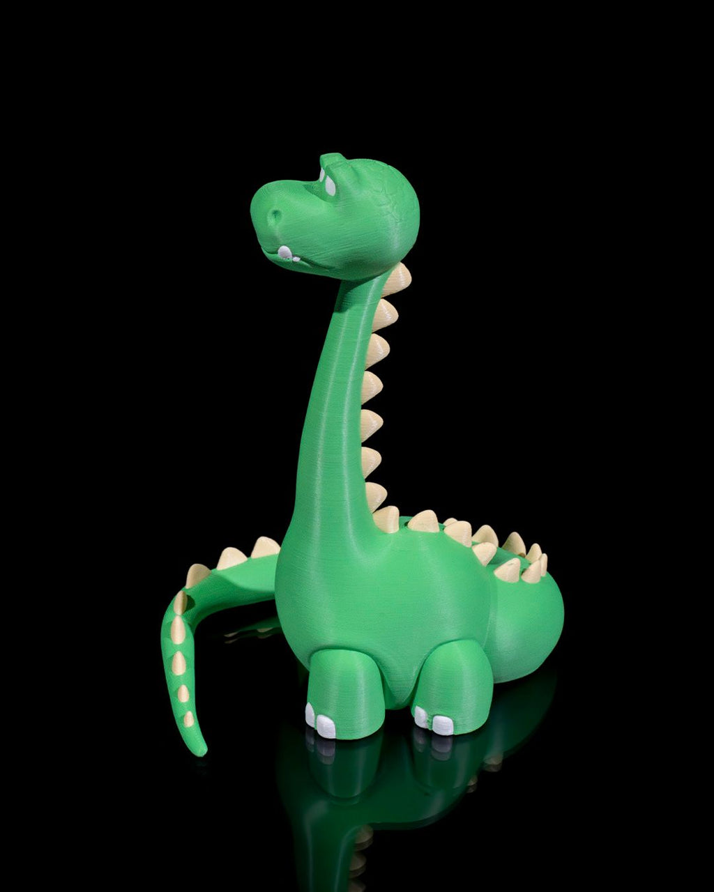 Grüner Dino-Handyhalter ohne Smartphone, Dreiviertelansicht aus anderem Blickwinkel mit gepunktetem Schwanz, schwarzer Hintergrund