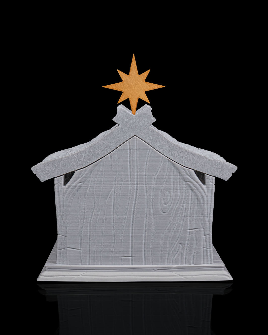 LED Weihnachtskrippe Bright Nativity, Frontalansicht mit Dach und goldenem Stern, Innenraum unbeleuchtet im Schatten – Münch3D