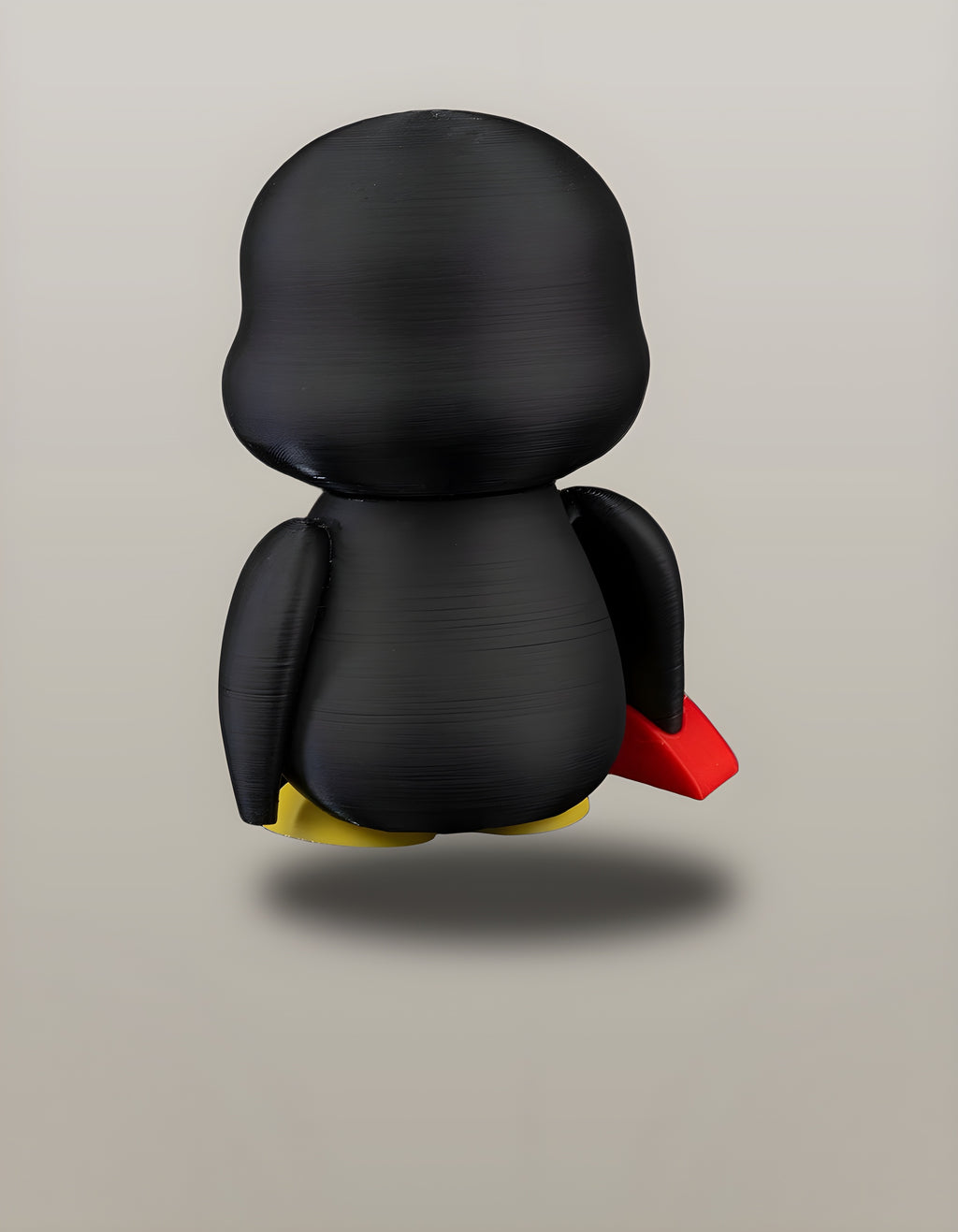 Einzelne Pinguin-Figur, freigestellt, Rückansicht mit gelben Füßen – Münch3D