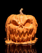 Frontalansicht der schmelzenden Kürbis-Süßigkeitenbox mit gruseligem Gesicht, Halloween-Deko aus dem 3D-Drucker