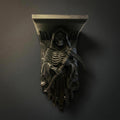 Grim Reaper wall shelf in matte black, front view mounted on a dark grey wall