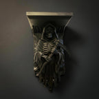 Grim Reaper wall shelf in matte black, front view mounted on a dark grey wall