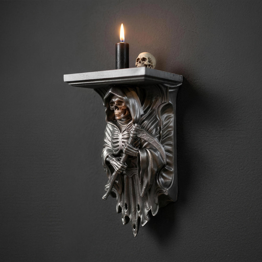 Silver Grim Reaper wall shelf styled with a burning candle and decorative skull on top